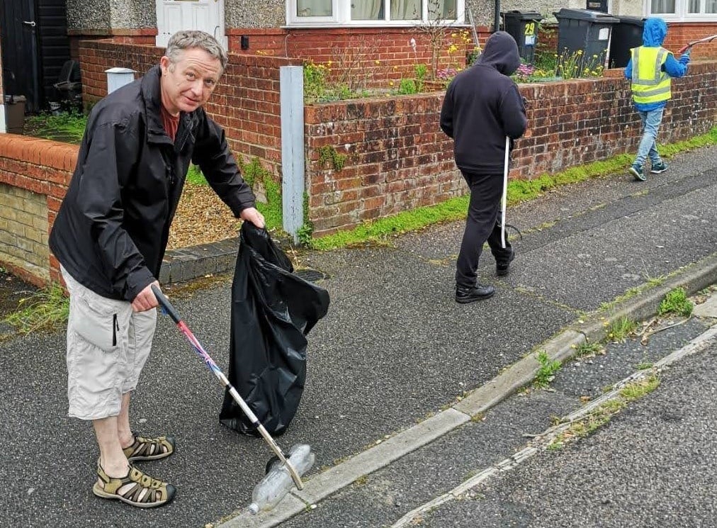 Simon Bull litter-picking in Acland Road, Winton