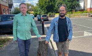 Cllrs Simon Bull and Chris Rigby at a street tree stump in Winton East